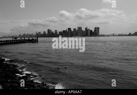 black white view of lower manhattan south side from liberty island new york city USA Stock Photo