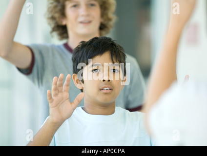 Preteen boys waving Stock Photo