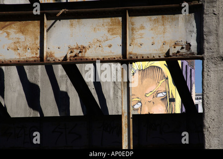 Graffiti of face peeking through girders. Catherine Street, Montreal, Quebec, Canada Stock Photo