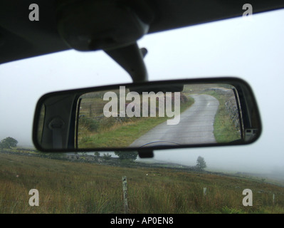 concept image of car on loenly country lane Stock Photo