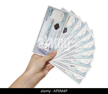 American Express 1000 dollar travelers cheques in a hand Stock Photo