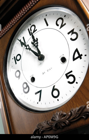 Clock showing five minutes to twelve Stock Photo