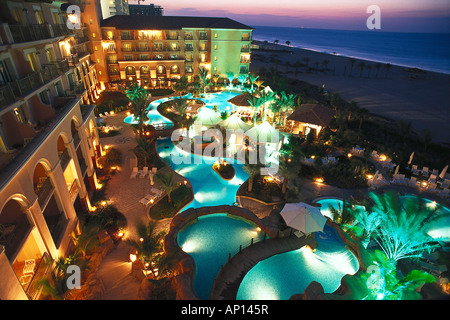 Illuminated pool and terrace of Hotel Ritz Carlton at night, Dubai, United Arab Emirates Stock Photo