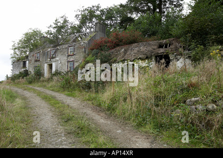 Abandoned derelict thatched cottage and farm house near Killybegs Donegal Ireland
