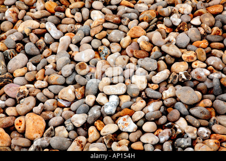 FLINT COBBLES IN A VARIETY OF COLORS LYING ON BEACH Stock Photo