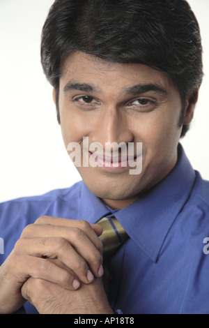 ANG200046 Executive looking into camera and smiling Model release No 687M Stock Photo