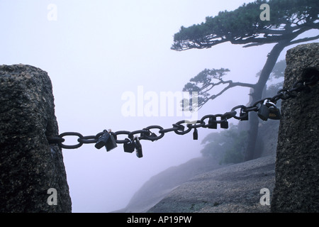 Padlocks on a chaine in front of sheer, Huang Shan, Anhui province, China, Asia Stock Photo