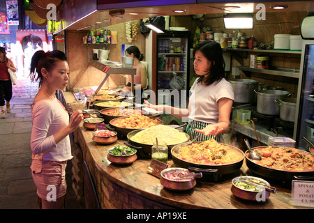 Food stall selling Chinese food at Camden Market in London Stock Photo