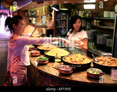 Food stall selling Chinese food at Camden Market in London Stock Photo