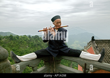 flute playing monk, music teacher, Wudang Shan, Taoist mountain, Hubei province, Wudangshan, Mount Wudang, UNESCO world cultural Stock Photo