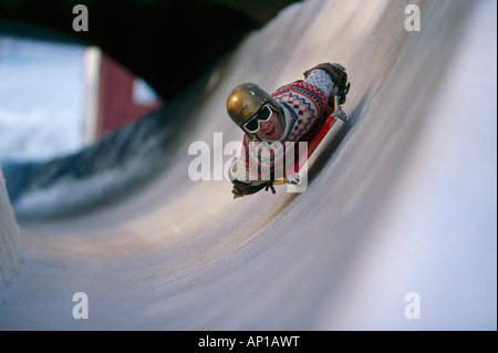 Person sliding down the ice channel in skeleton position, Cresta Run, St. Moritz, Grisons, Switzerland, Europe Stock Photo