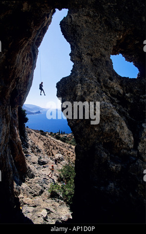 Kalymnos, Greece, Aegean Sea, a climber abseils in a cave above the sea. Kalymnos, Greece, Aegean Sea, Europe Stock Photo