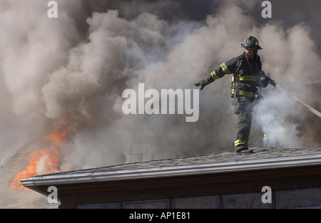Firefighters fighting a fire House fire in New Haven CT USA Stock Photo