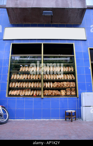 bread loaves on display in bakery Stock Photo