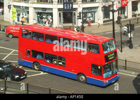 Red no advertising London bus service on route 6 crossing box junction at Piccadilly Circus Stock Photo