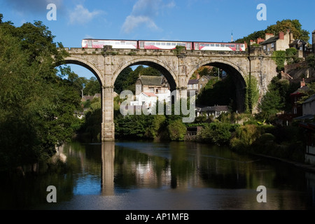 A Northern Rail Train crosses The Railway Viaduct over The River Nidd at Knaresborough North Yorkshire England Stock Photo