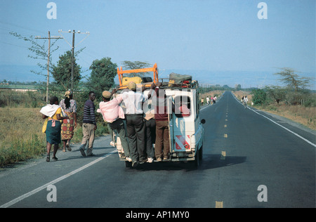 Overloaded local taxi or MATATU on Naivasha South Road near Lake Naivasha Kenya East Africa Stock Photo