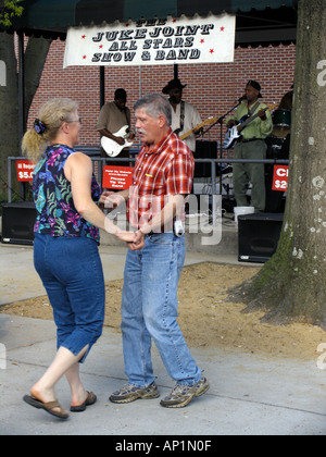 Couple dancing to blues band in Handy Park Beale Street Memphis USA Stock Photo