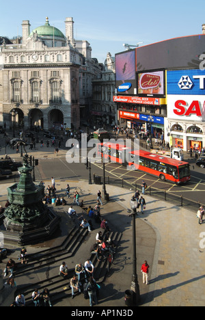 General view of Piccadilly Circus and people gathered around Eros statue and fountain Stock Photo