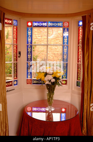 A COTTAGE BAY WINDOW WITH STAINED GLASS EDGING Stock Photo