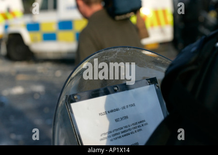 police warnings use of force instructions PSNI baton round warning on shield during riot on crumlin road at ardoyne shops belfast 12th July Stock Photo