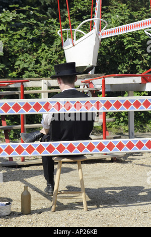 Back of fairground worker in black top hat at the Old Town Museum Den Gamle By in Arhus Denmark Stock Photo