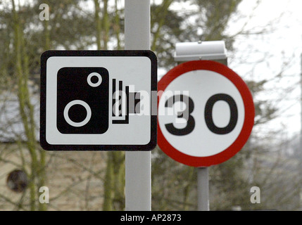 Police Slow sign in front of a police car Stock Photo - Alamy