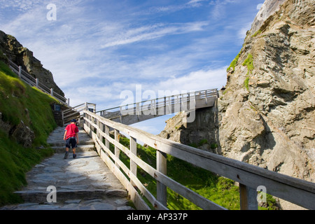 Steps and wooden walkway leading up to King Arthur s castle in Tintagel north Cornwall Stock Photo