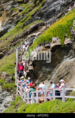 Crowded wooden walkway to King Arthur s Castle in Tintagel north Cornwall Stock Photo