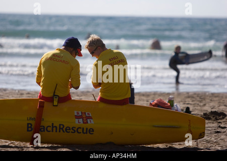 Lifeguards on duty at a crowded public beach Stock Photo