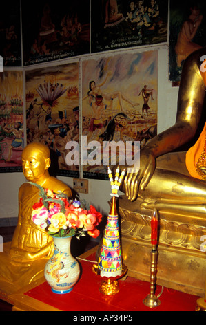 Golden Buddhas and frescoes on the walls of Santi Chedi 'Peace Pagoda', Luang Prabang, Laos Stock Photo