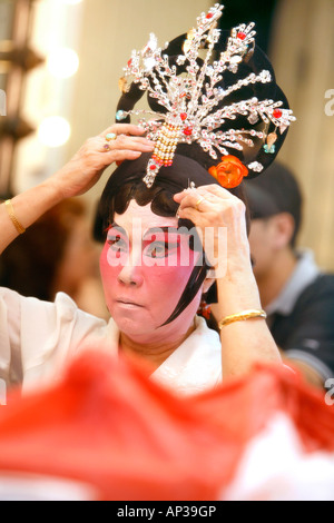 Woman in mask, Chinese Opera at the Kreta Ayer Theatre, Chinatown, Singapore Stock Photo