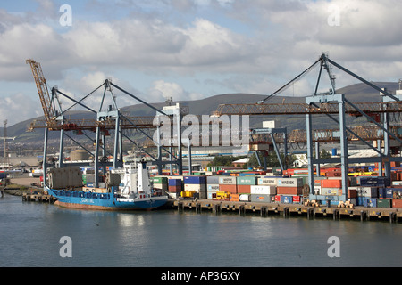 Containers being loaded onto the Coastal Deniz ship in Port of Belfast Stock Photo