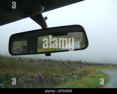 concept image of car on loenly country lane Stock Photo