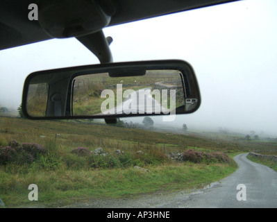 concept image of car on loenly country lane Stock Photo