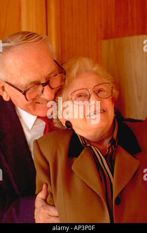 Couple age 72 embracing in the presence of God. St Paul Minnesota MN USA Stock Photo
