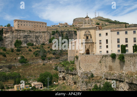 The hanging houses and cliffs of Cuenca, Spain, over the river gorge. In foreground, the Convent of San Pablo (now a hotel). Stock Photo