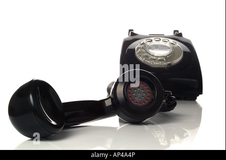 Retro black phone with focus on the handset in the foreground Stock Photo