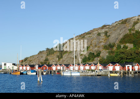 Beach huts and boats in sea, Asperö, Göteborgs Södra skärgård, Sweden Stock Photo