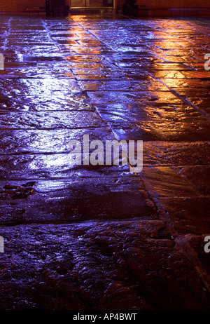 Light reflecting on the wet paved area in front of Greaves Arms pub. Oldham, Greater Manchester, United Kingdom. Stock Photo