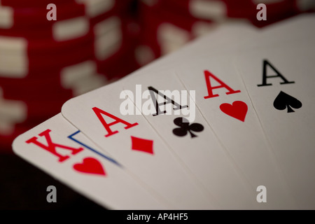 Four of a kind poker hand with poker chips Stock Photo