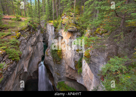 A falls in a narrow and deep canyon in the north of Canada Stock Photo