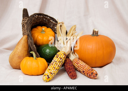 Thanksgiving harvest scene with cornucopia featuring pumpkins corn and other fruits and vegetables Stock Photo