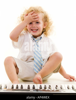 Little boy on keyboard Stock Photo