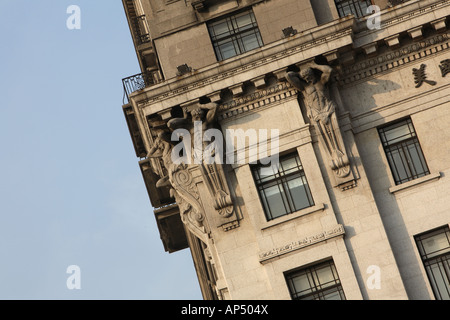 Figures of Atlas hold up the roof of the North China Daily News building The Bund Shanghai China Stock Photo