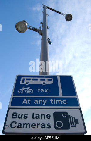 british bus lane sign indicating cctv cameras and permitted useage by cyclists and taxis Stock Photo