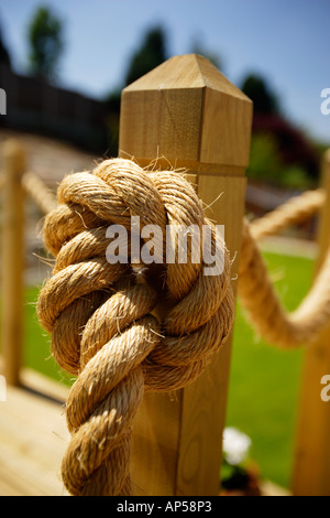 Tining Rope To Post A rope, barrier rope attached to a wooden post, as a path fence Stock ...