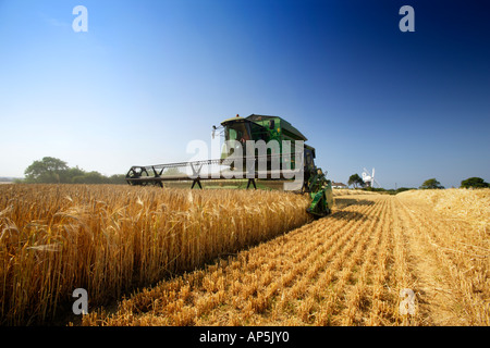 John Deere Combine Harvester Barley Harvesting Mundesley Norfolk UK Stock Photo