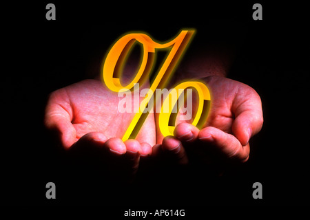 Two Hands with % percentage symbol, digital composite Stock Photo