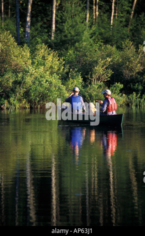 Freedom, NH Fly-fishing from a canoe in Trout Pond. Part of future town forest. (MR) Stock Photo